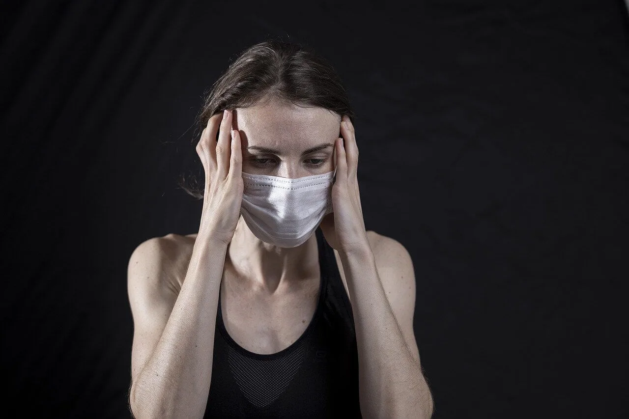 A person experiencing head and anxiety-related tension.